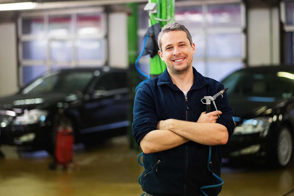 man in shop smiling